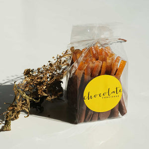 Orangettes, handcrafted chocolate-dipped candied orange peel with a perfect balance of bittersweet citrus and rich dark chocolate.